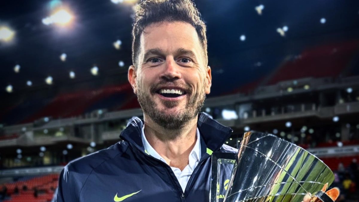 Trophy in hand, after the final